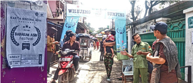 Poster Babakan Asih Festival acara yang akan dimulai malam hari itu